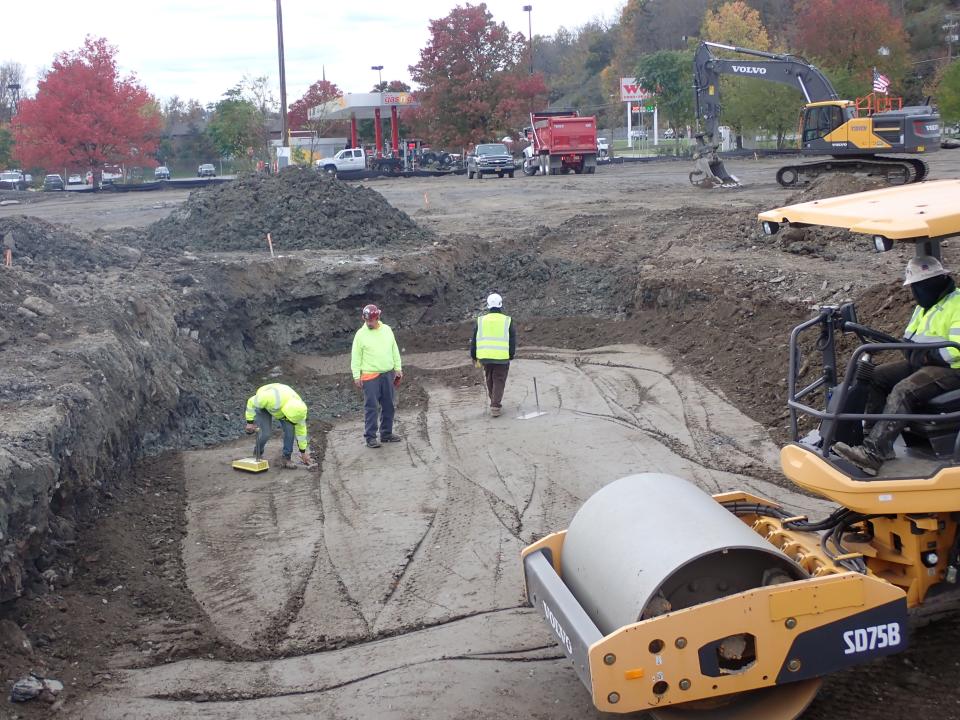 Work underway at the complex that will include Starbucks, Chipotle and Panera Bread restaurants as well as a multi-story, 110-unit apartment complex at the rear of the lot.