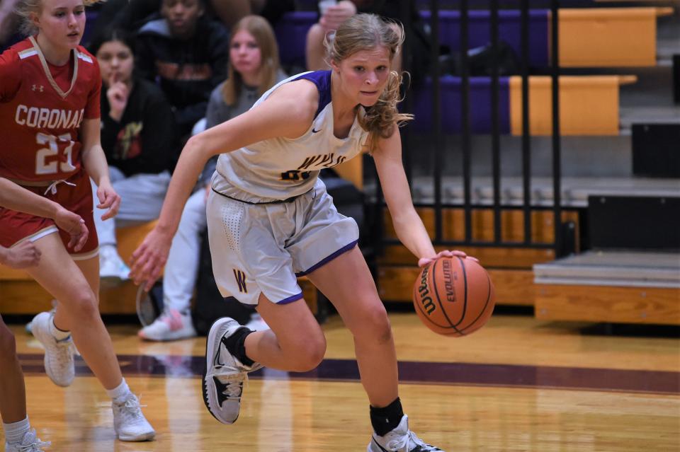 Wylie's Kaylan Adams (23) drives to the basket during Friday's game against Lubbock Coronado. Adams finished with a game-high 17 points in the 51-48 victory.