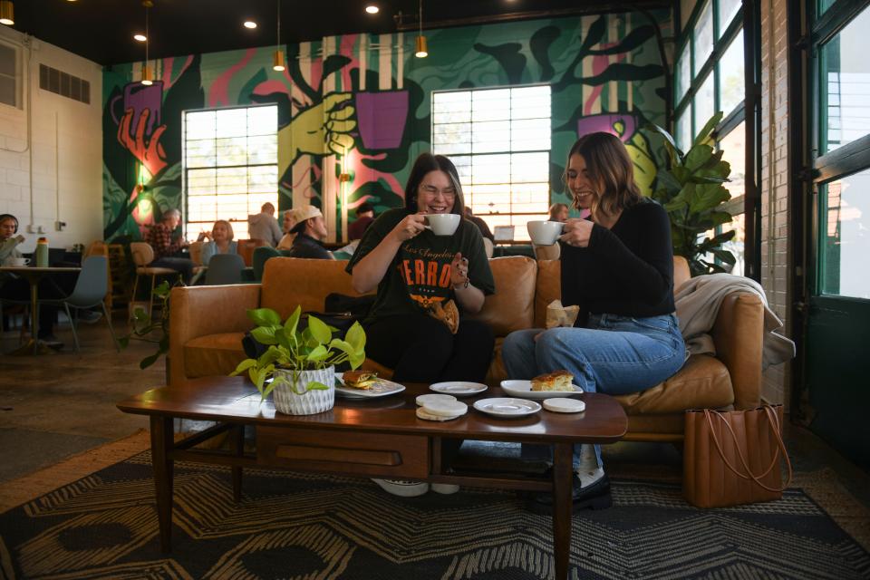 Amanda Gulino (left) and Hannah Powell (right) have a cup of coffee at Trellis Coffee Bar off Walton Way on Wednesday, Nov. 1, 2023.