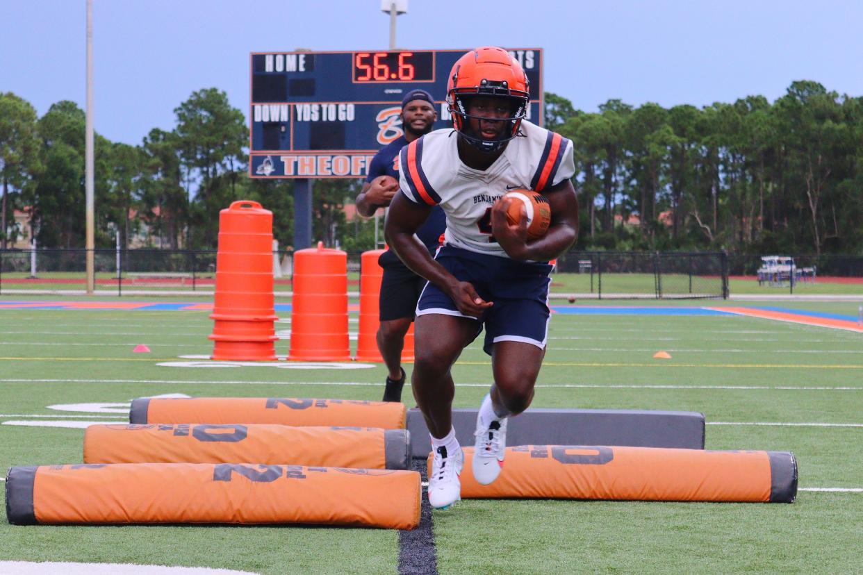 Georgia RB commit Chauncey Bowens runs drills with encouragement from his coach on Benjamin’s second day of fall camp.