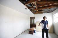 Angel Silva talks about the blast that damaged his newly purchased home on Bridgeland Lane in Houston, Sunday, Jan. 26, 2020, after the Watson Grinding Manufacturing explosion early Friday morning. (Karen Warren/Houston Chronicle via AP)
