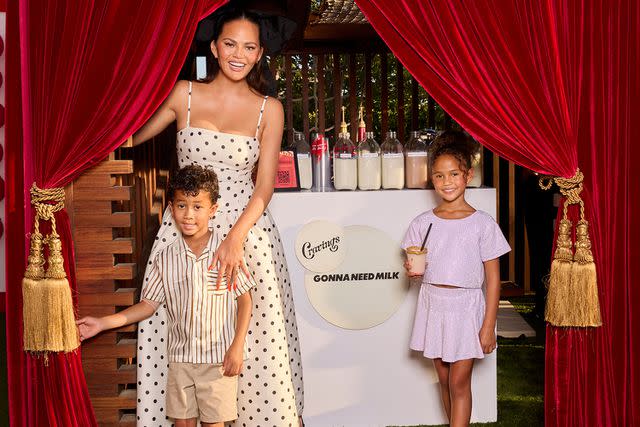 <p>Max Bronner</p> Chrissy Teigen with her kids Miles and Luna.