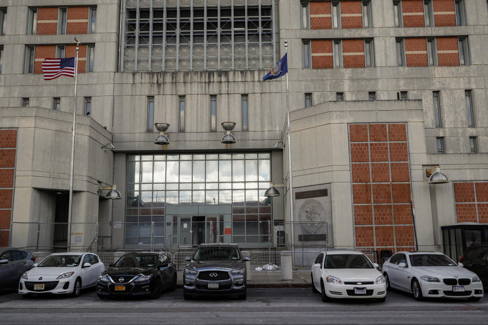 Fencing stands outside the main entrance of the Metropolitan Detention Center, Brooklyn where British socialite Ghislaine Maxwell is held, Tuesday, July 14, 2020, in New York. Jeffrey Epstein's former girlfriend has been denied bail and will remain behind bars on charges she recruited girls and women for the financier to sexually abuse more than two decades ago. (AP Photo/John Minchillo)