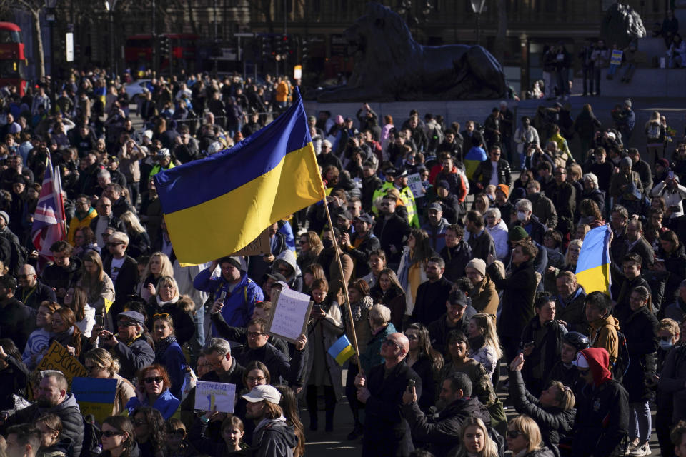 Ukrainian flags wave in Trafalgar Square as people descend to attend a protest, in London, Sunday, Feb. 27, 2022. A Ukrainian official says street fighting has broken out in Ukraine's second-largest city of Kharkiv. Russian troops also put increasing pressure on strategic ports in the country's south following a wave of attacks on airfields and fuel facilities elsewhere that appeared to mark a new phase of Russia's invasion. (AP Photo/Alberto Pezzali)