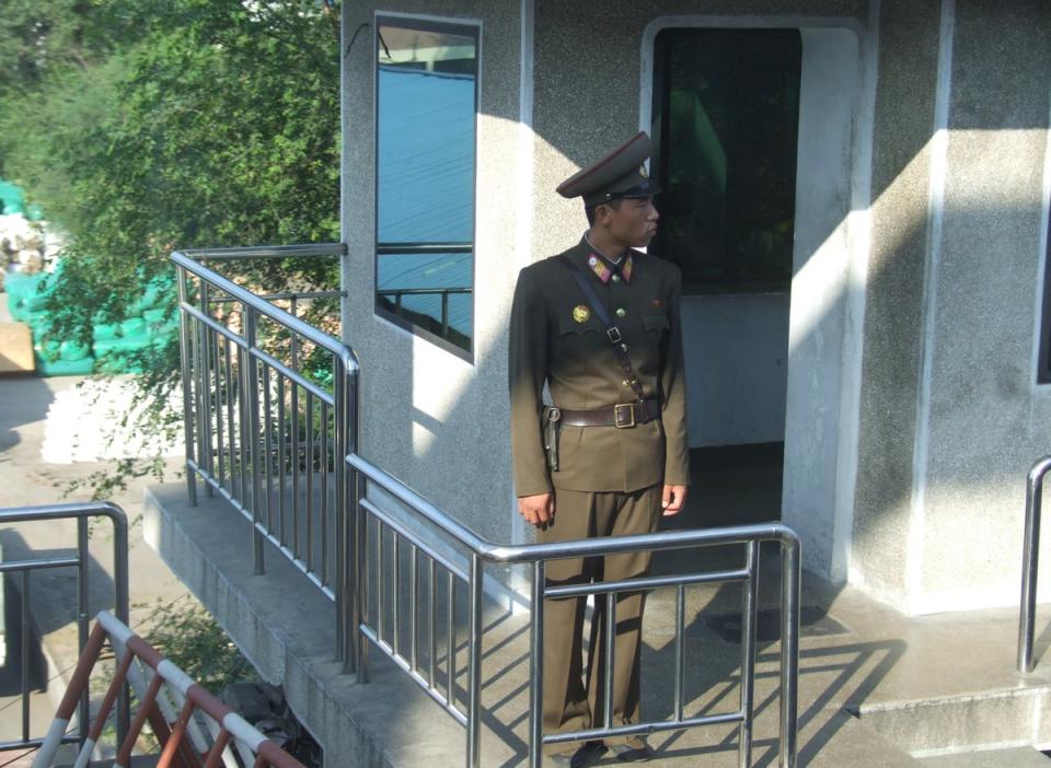 A North Korean soldier stationed at border near China, date unknown (Sourced/The Independent)
