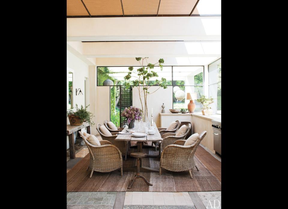 This screened porch is an addition to the house made by the couple. 