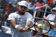 Mardy Fish of the U.S. hits a return to Feliciano Lopez of Spain during their match at the U.S. Open Championships tennis tournament in New York, September 2, 2015. REUTERS/Mike Segar