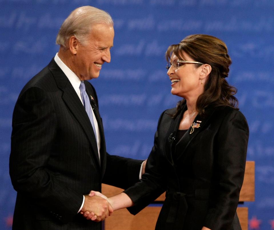 Democratic vice presidential candidate Joe Biden and Republican candidate Sarah Palin shake hands after a vice presidential debate at Washington University in St. Louis on Oct. 2, 2008.