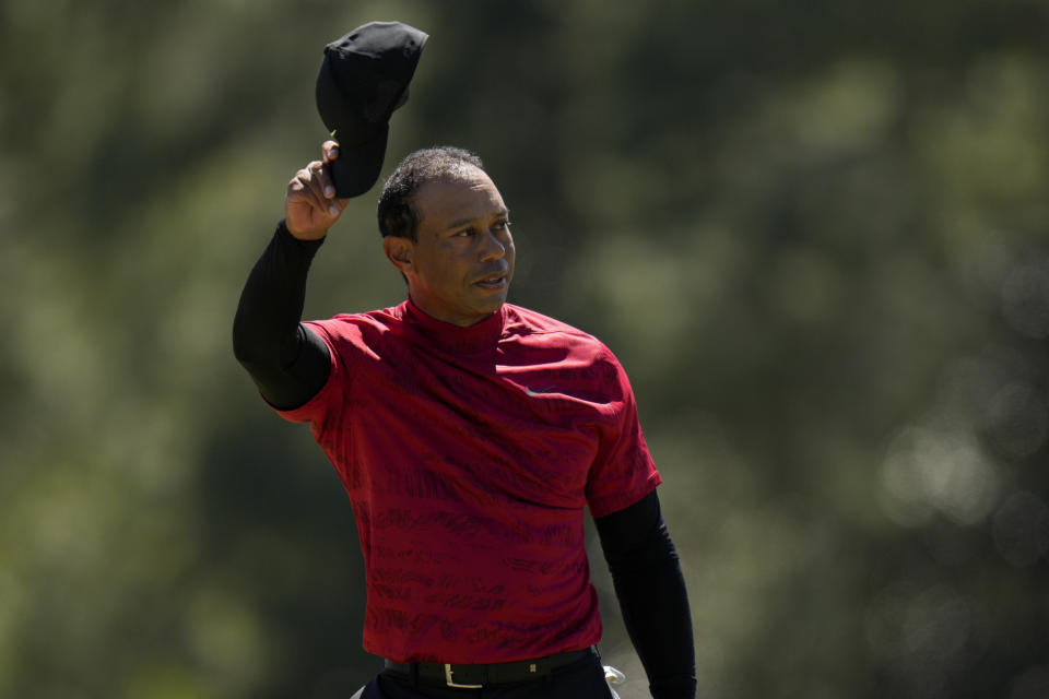 Tiger Woods tips his cap on the 18th green during the final round at the Masters golf tournament on Sunday, April 10, 2022, in Augusta, Ga. (AP Photo/Jae C. Hong)