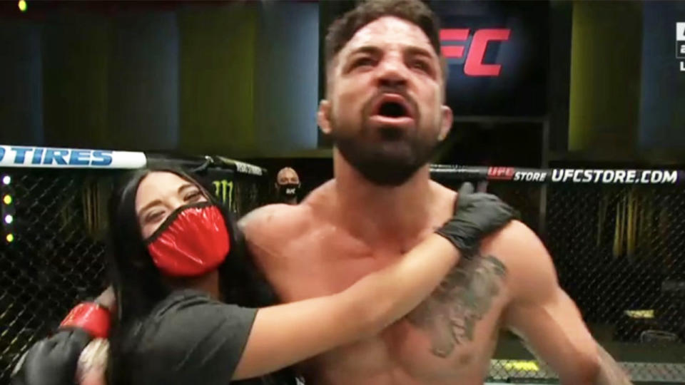 UFC fighter Mike Perry celebrates with girlfriend Latory Gonzalez.