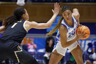 Duke's Reigan Richardson (24) looks to pass the ball around Colorado's Tayanna Jones (1) during the first half of a second-round college basketball game in the NCAA Tournament, Monday, March 20, 2023, in Durham, N.C. (AP Photo/Karl B. DeBlaker)