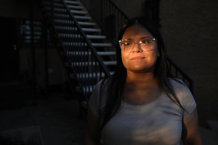 LOS ANGELES, CA - FEBRUARY 14, 2024 - - Angelica Belmont, 35, a CVS shift supervisor, has benefited from the Los Angeles City Fair Work Week Ordinance that was passed in April of last year. Before the ordinance she would close the Los Angeles store at 10 p.m. and open at 6 a.m. the next day. She hardly had enough time to rest in between. When she would get called in to cover afternoon shifts, she'd scramble to find someone to pick up her three kids from school. Belmont now has set days off and the ordinance makes a big difference for work schedule and for her family. (Genaro Molina/Los Angeles Times)