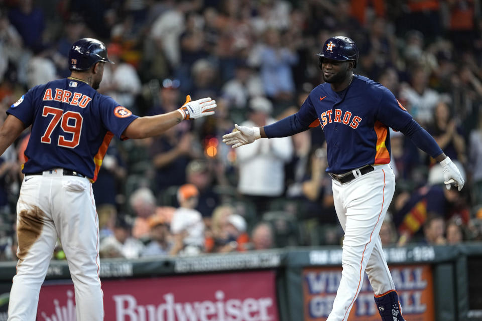 Houston Astros' Yordan Alvarez, right, celebrates with José Abreu (79) after hitting a home run against the Kansas City Royals during the fifth inning of a baseball game Sunday, Sept. 24, 2023, in Houston. (AP Photo/David J. Phillip)