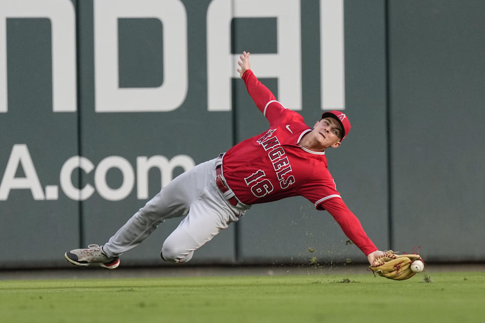 Los Angeles Angels center fielder Mickey Moniak can't catch a ball hit for a single by Atlanta Braves' Austin Riley in the first inning of a baseball game Tuesday, Aug. 1, 2023, in Atlanta. Riley advanced to second base. (AP Photo/John Bazemore)