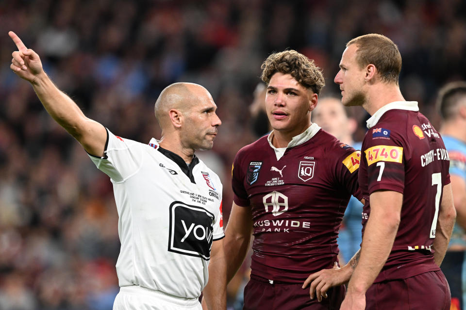 Reece Walsh being marched from the field in Origin.