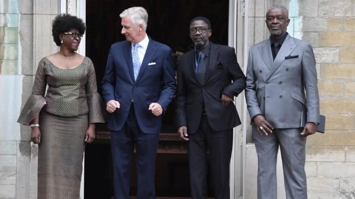 Belgium’s King Philippe (second from left) greets the children of Congo’s former prime minister Patrice Lumumba (from left), Juliana, Francois and Roland, at the Royal Palace in Brussels, Monday. (Photo: Geert Vanden Wijngaert/AP)