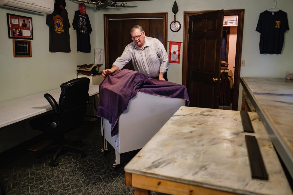 Bob Koch, who operates Koch Caramel in Freeport, wheels out the caramel cutting machine. The caramel shop is run out of the family home.