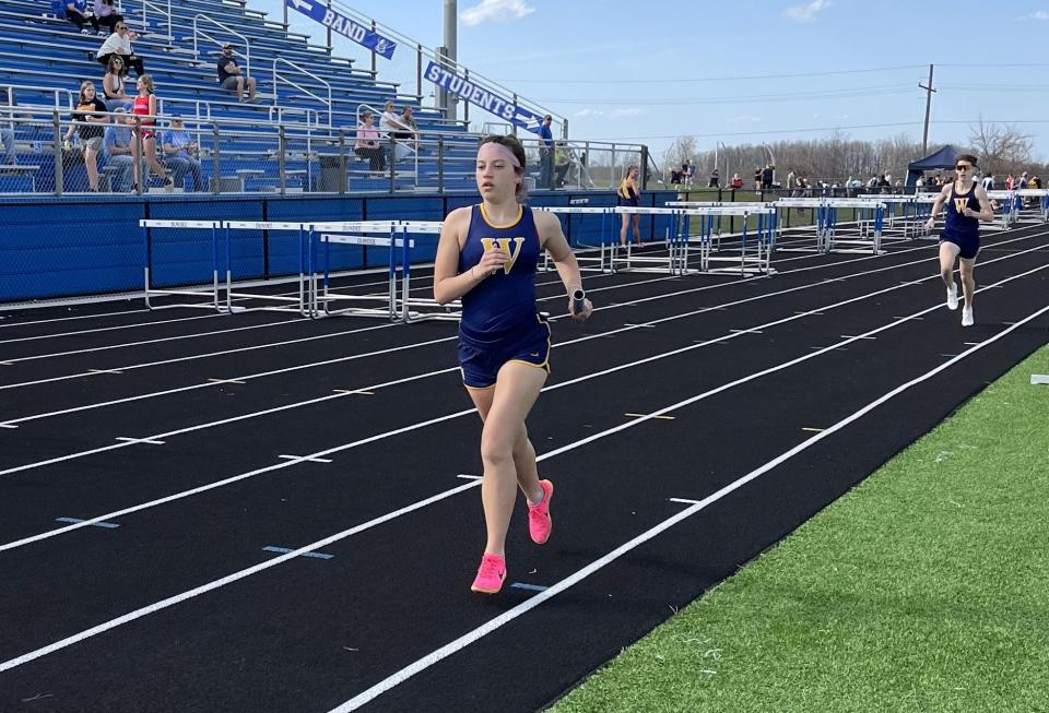 Braelynn Chiotti runs the 3,200-meter relay for Whiteford on Tuesday, April 9, 2024.