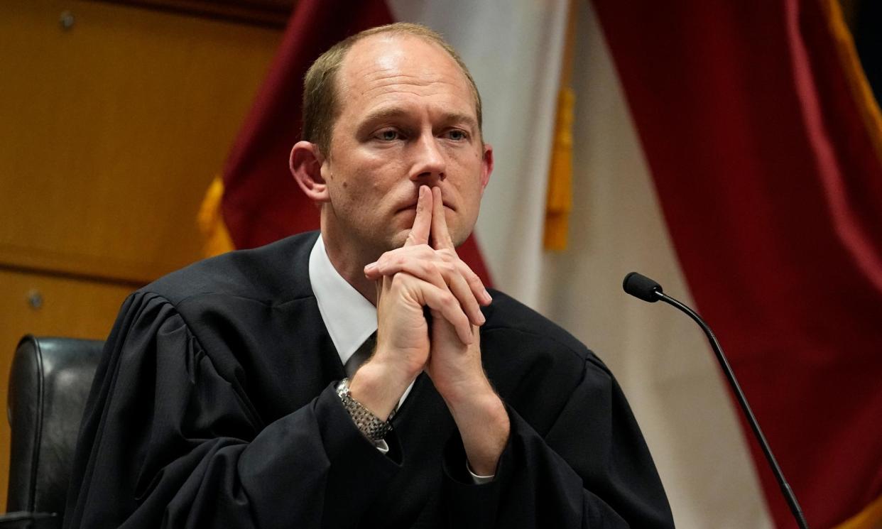 <span>The Fulton county superior judge Scott McAfee dismissed some of the charges against Donald Trump.</span><span>Photograph: Brynn Anderson/AP</span>