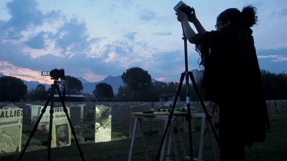 For a 2018 art show, Annu Palakunnathu Matthew projects British Imperial War Museum's archival footage of Indian soldiers onto South Asian gravestones at the Cassino War Cemetery in Italy's Frosinone province, nearly 90 miles southeast of Rome.