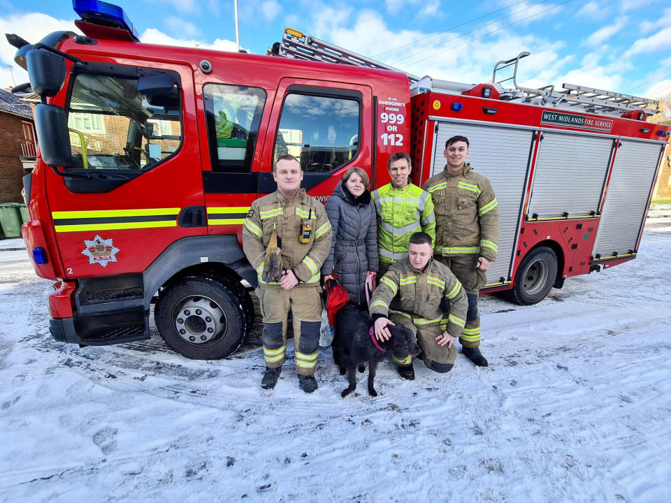 Bella and the firefighters who rescued her. (SWNS)
