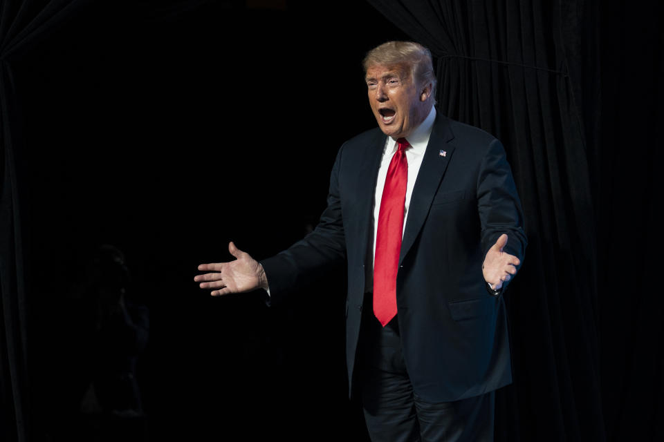 In this June 23, 2020, photo, President Donald Trump arrives to speak to a group of young Republicans at Dream City Church in Phoenix. Trump is sharpening his focus on his ardent base of supporters as polls show a diminished standing for the president in battleground states that will decide the 2020 election (AP Photo/Evan Vucci)