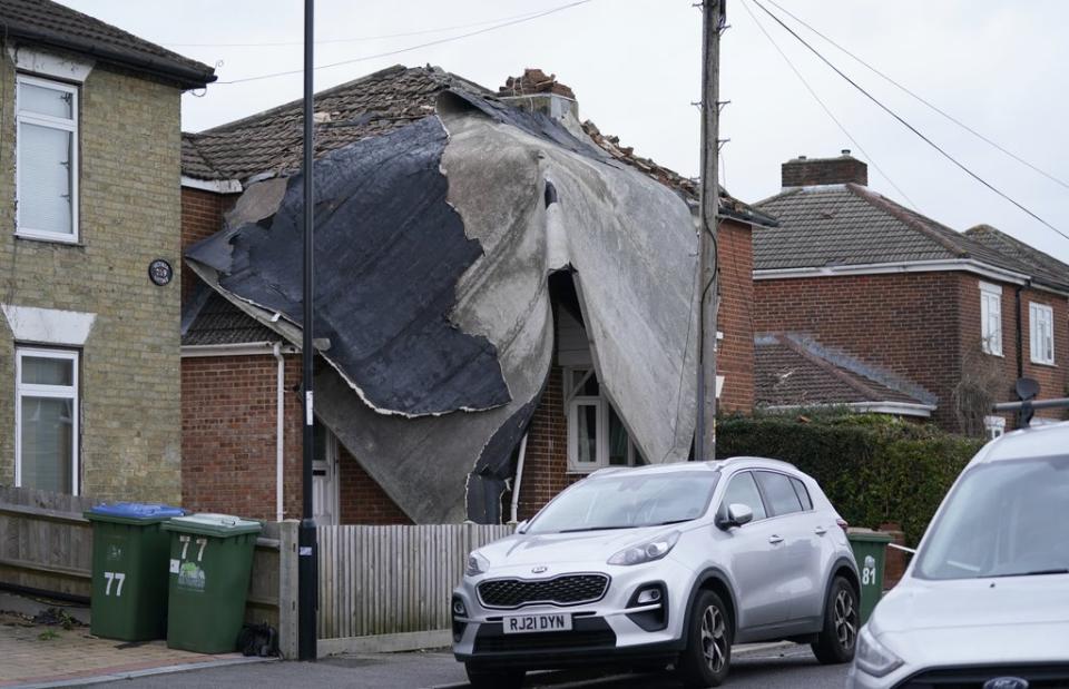 A house in Southampton is draped in part of a flat roof that blew off a nearby building (Andrew Matthews/PA) (PA Wire)