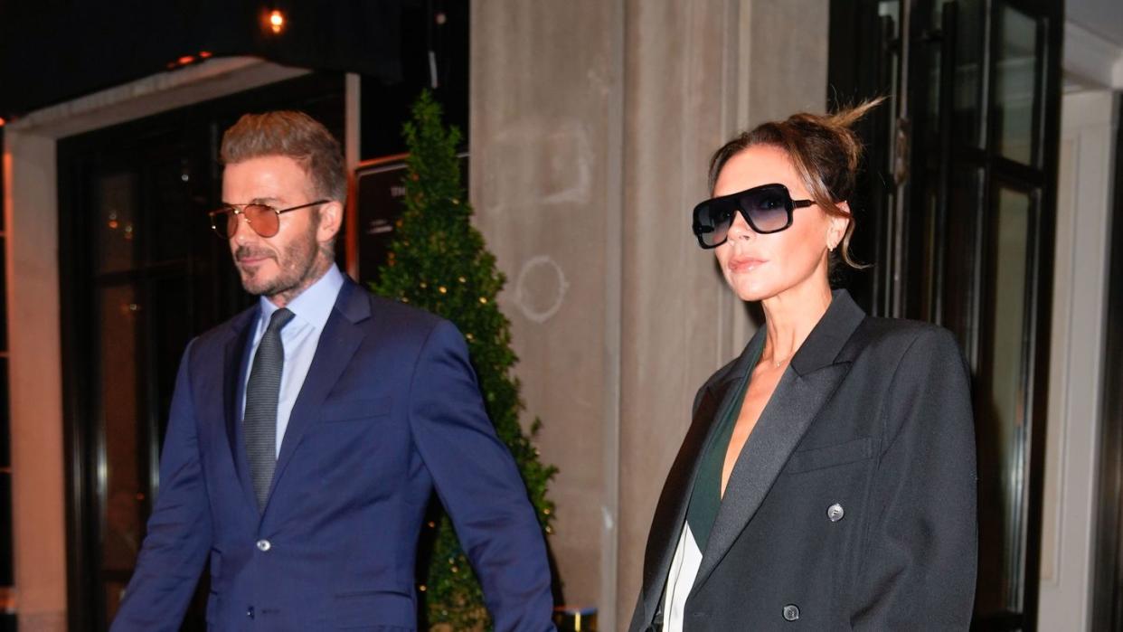 david and victoria beckham outside of a hotel in new york city