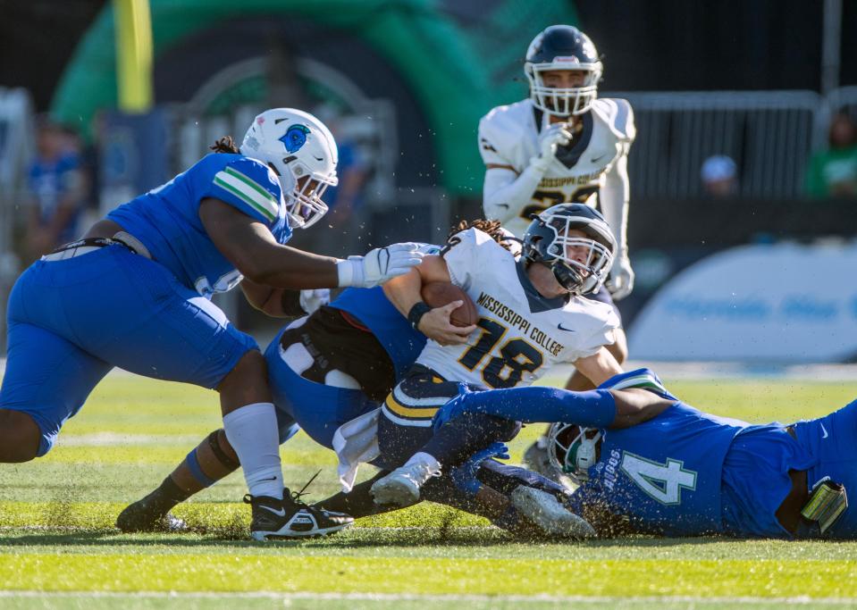 West Florida's defense brings down Mississippi College's  quarterback John Henry White during action against Mississippi College Saturday, October 22, 2022 at Pen Air Field at the University of West Florida. West Florida went on to beat Mississippi College 45-17.