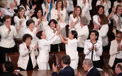 Democratic female members of Congress wear white to celebrate there being more female members than ever - Credit: JONATHAN ERNST&nbsp;/REUTERS