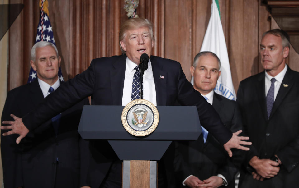 President Trump, accompanied by, from left, Vice President Mike Pence, Environmental Protection Agency Administrator Scott Pruitt and Interior Secretary Ryan Zinke, speaks at EPA headquarters in Washington on March 28, 2017, prior to signing an Energy Independence Executive Order. (Photo: Pablo Martinez Monsivais/AP)