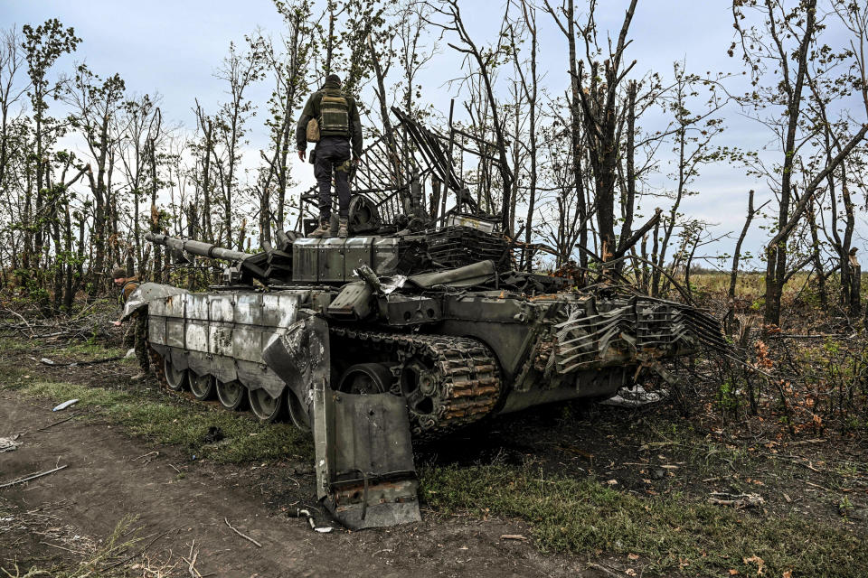 Image: A Ukrainian soldier standing atop an abandoned Russian tank near a village on the outskirts of Izyum, Kharkiv Region, eastern Ukraine on Sept. 11, 2022. (Juan Barreto / AFP - Getty Images)