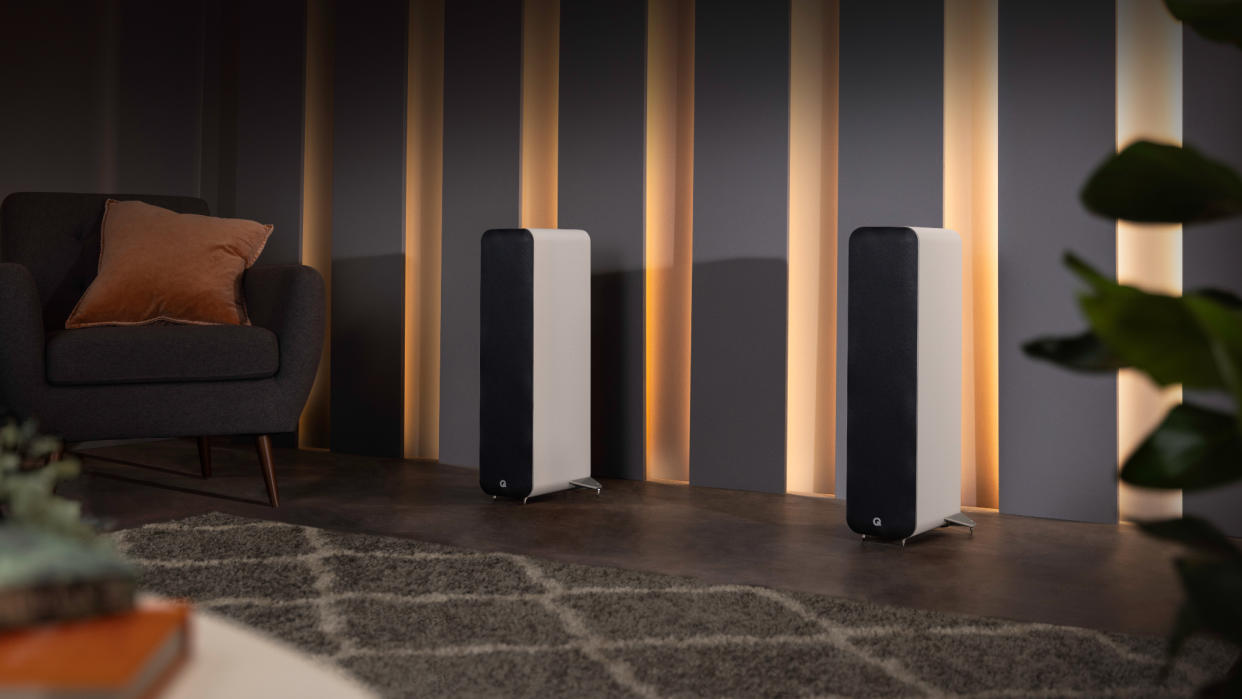  Q Acoustics M40 white towers in a living room . 