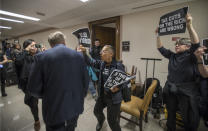 <p>Sen. Lindsey Graham, R-S.C., left, is confronted by protesters as they shout their disapproval of the Republican tax bill outside the Senate Budget Committee hearing room on Capitol Hill in Washington, Tuesday, Nov. 28, 2017. (Photo: J. Scott Applewhite/AP) </p>