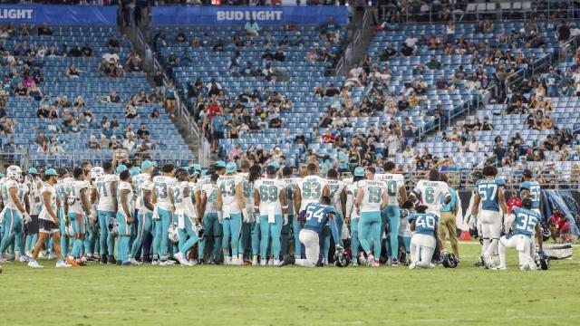 Miami Dolphins player Daewood Davis 'has movement in all extremities' after  injury that led to suspension of game, team says