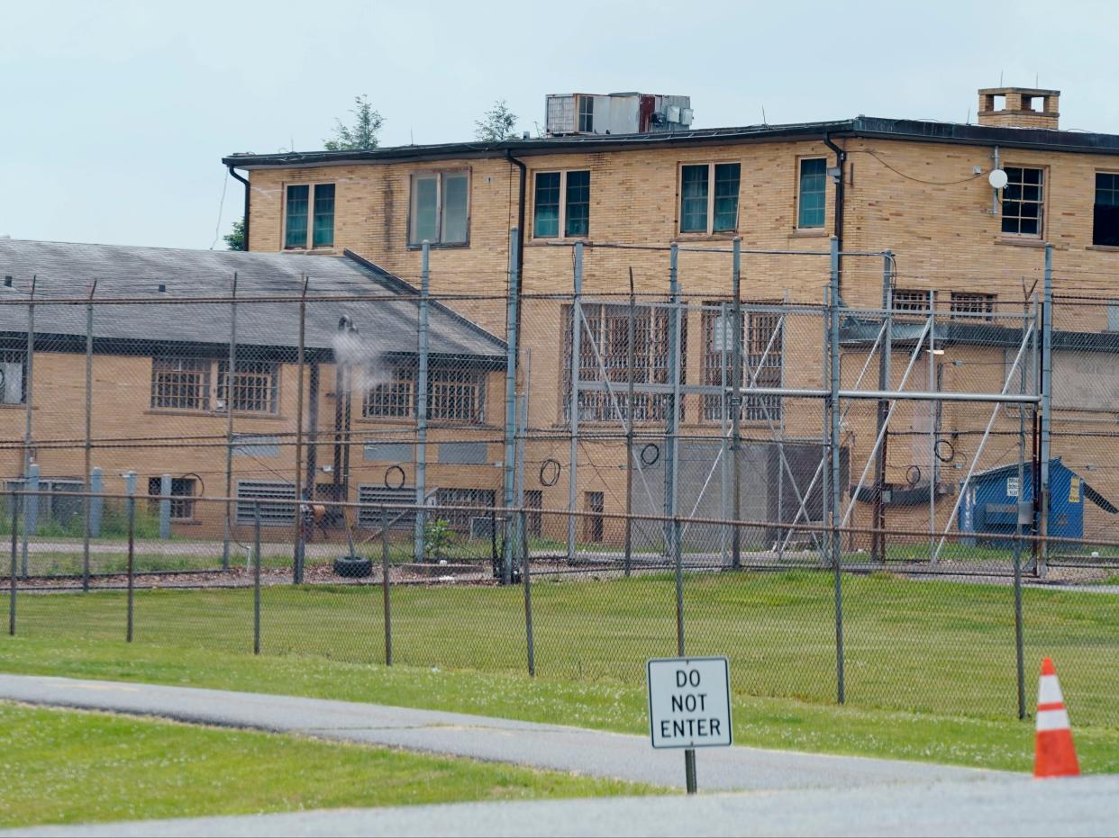 High fences surround buildings on the grounds of the Edna Mahan Correctional Facility for Women in Clinton, New Jersey (AP)