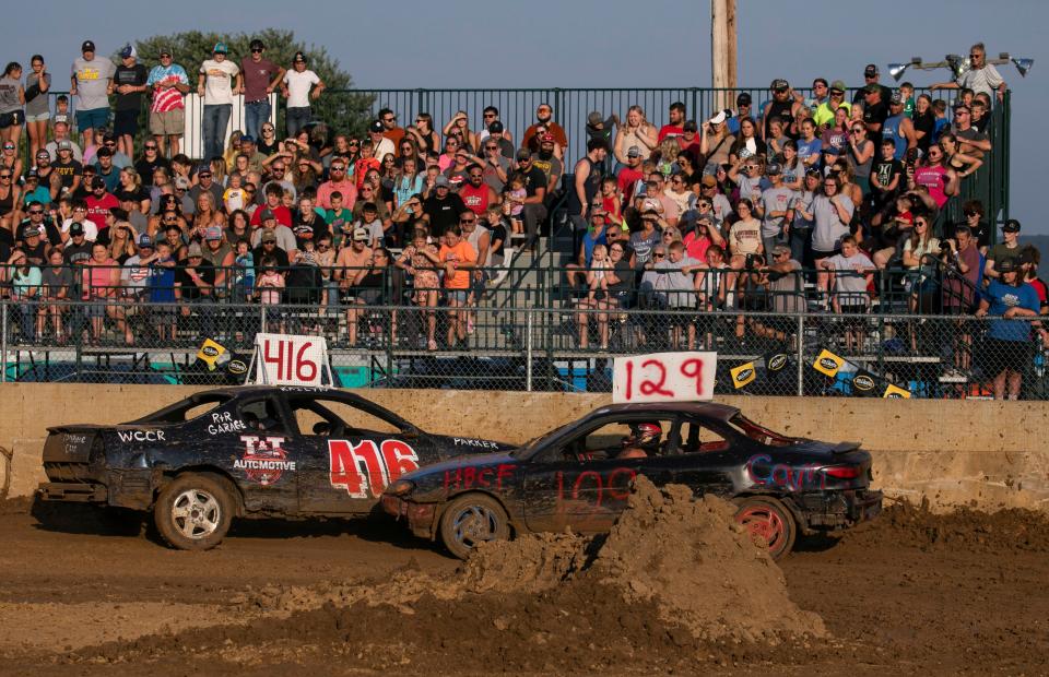 Racers put on a show for the fans in the grandstand area during the Auto Cross race at the Ross County Fair on August 11, 2023, in Chillicothe, Ohio.