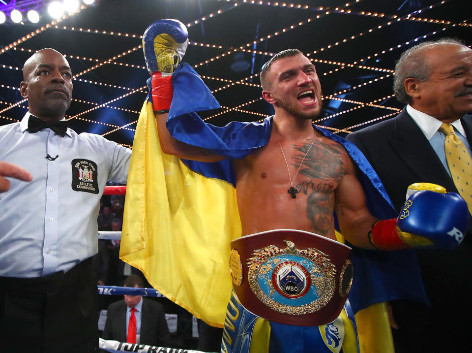 WBO super featherweight champion Vasyl Lomachenko celebrates after stopping Guillermo Rigondeaux after six rounds on Dec. 9 in New York. (Mikey Williams/Top Rank)