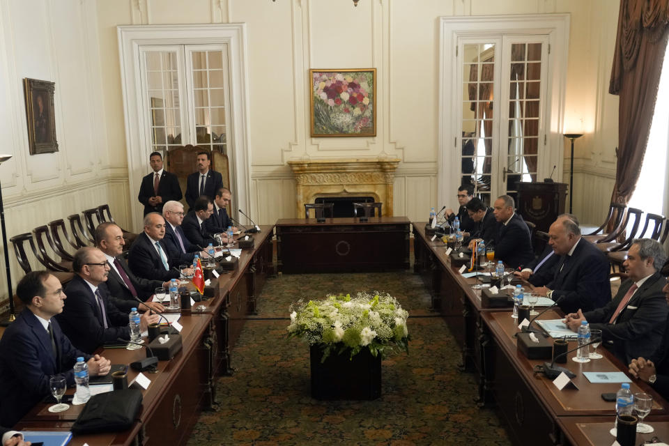 Egyptian Foreign Minister Sameh Shoukry, second right, meets with his Turkish counterpart Mevlut Cavusoglu, third left, and his delegations at Tahrir Palace in Cairo, Egypt, Saturday, March 18, 2023. The meeting is the first such high-level in more than a decade as the countries repair relations damaged in the wake of the 2011 Arab Spring. (AP Photo/Amr Nabil)