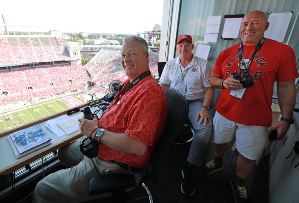 Ohio State play-by-play announcer Paul Keels (left), analyst Jim Lachey and spotter Tony Keels before a game in 2021.