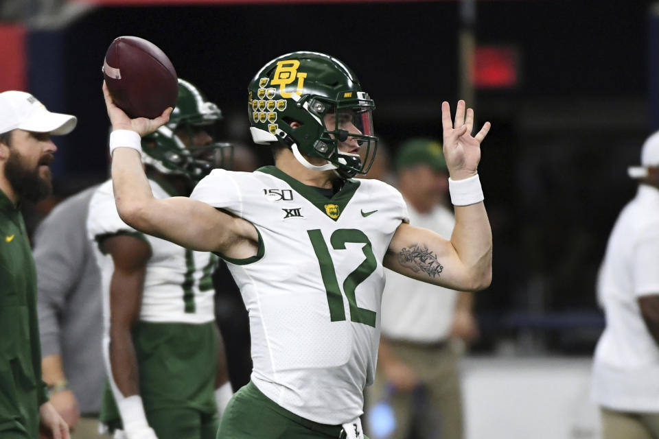 Baylor quarterback Charlie Brewer warms up before an NCAA college football game against OKlahoma at the Big 12 Conference championship, Saturday, Dec. 7, 2019, in Arlington, Texas. (AP Photo/Jeffrey McWhorter)