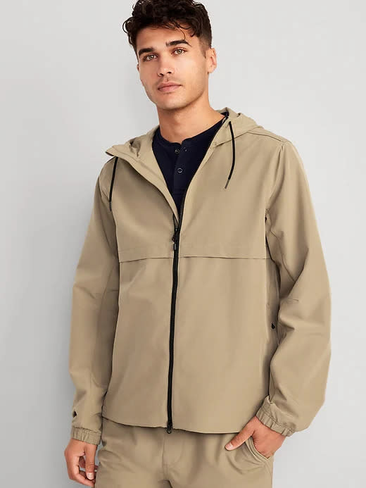 model wears tan StretchTech Water-Repellent Hooded 2-Way-Zip Jacket