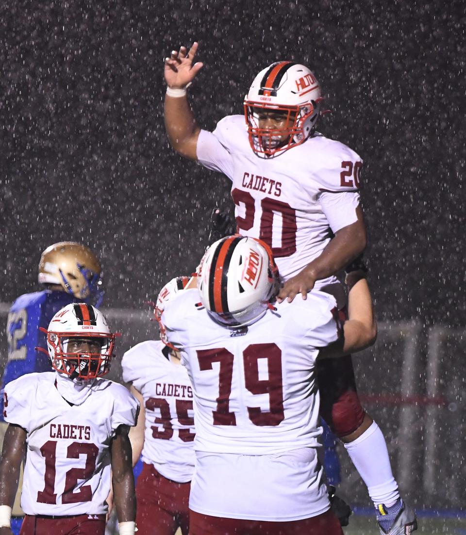 Jeffery Broadnax celebrates his touchdown with teammate Karl Kuhns during Hilton's 40-7 win over Webster Schroeder in the Section V Class C1 final on Nov. 11, 2022.