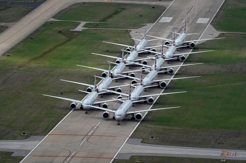 FILE PHOTO: American Airlines passenger planes crowd a runway in Tulsa