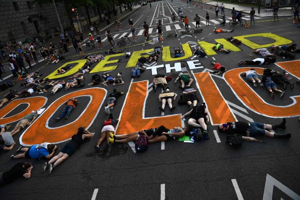 Demonstrators lie on the pavement in Washington DC.