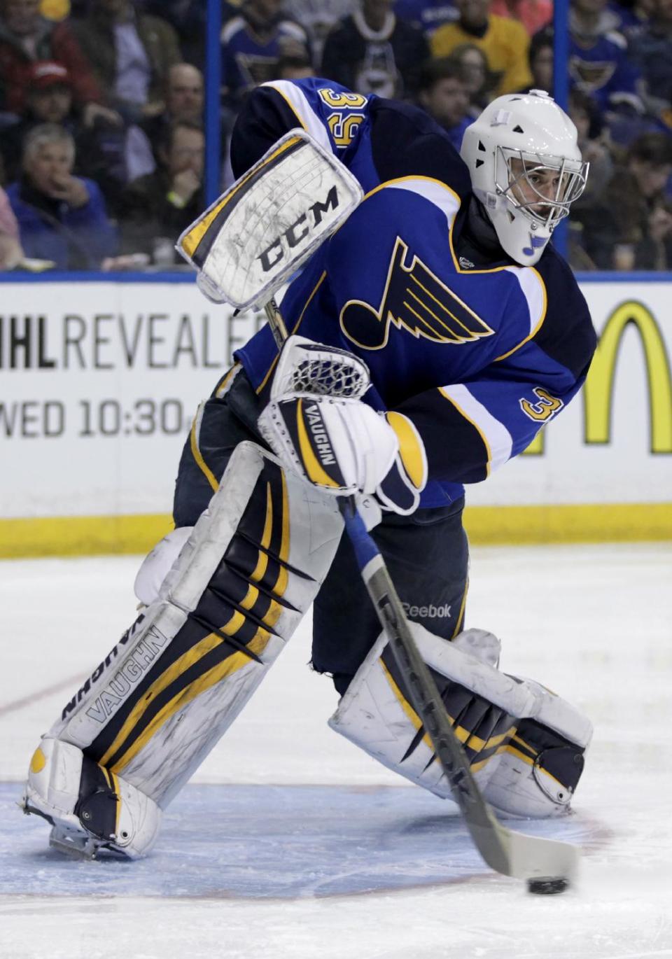 St. Louis Blues goalie Ryan Miller (39) sweeps away the puck during the first period of an NHL hockey game against the Tampa Bay Lightning, Tuesday, March 4, 2014 in St. Louis.(AP Photo/Tom Gannam)