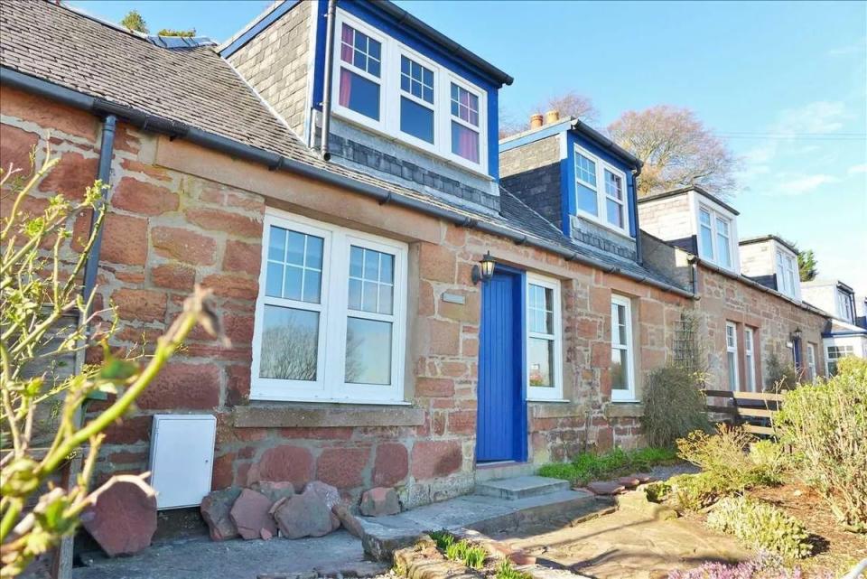 <p>With uninterrupted sea views, this well-maintained property is the ultimate seaside <a href="https://www.housebeautiful.com/uk/lifestyle/property/g36107053/airbnb-cottages/" rel="nofollow noopener" target="_blank" data-ylk="slk:cottage;elm:context_link;itc:0;sec:content-canvas" class="link ">cottage</a>. On the market for £215,000, the red sandstone property has a terraced garden, two double bedrooms and a kitchen with sea views. </p><p><a href="https://www.zoopla.co.uk/for-sale/details/58330511/" rel="nofollow noopener" target="_blank" data-ylk="slk:This property is currently on the market for £215,000 with Arran Estate Agents via Zoopla;elm:context_link;itc:0;sec:content-canvas" class="link ">This property is currently on the market for £215,000 with Arran Estate Agents via Zoopla</a>. </p>