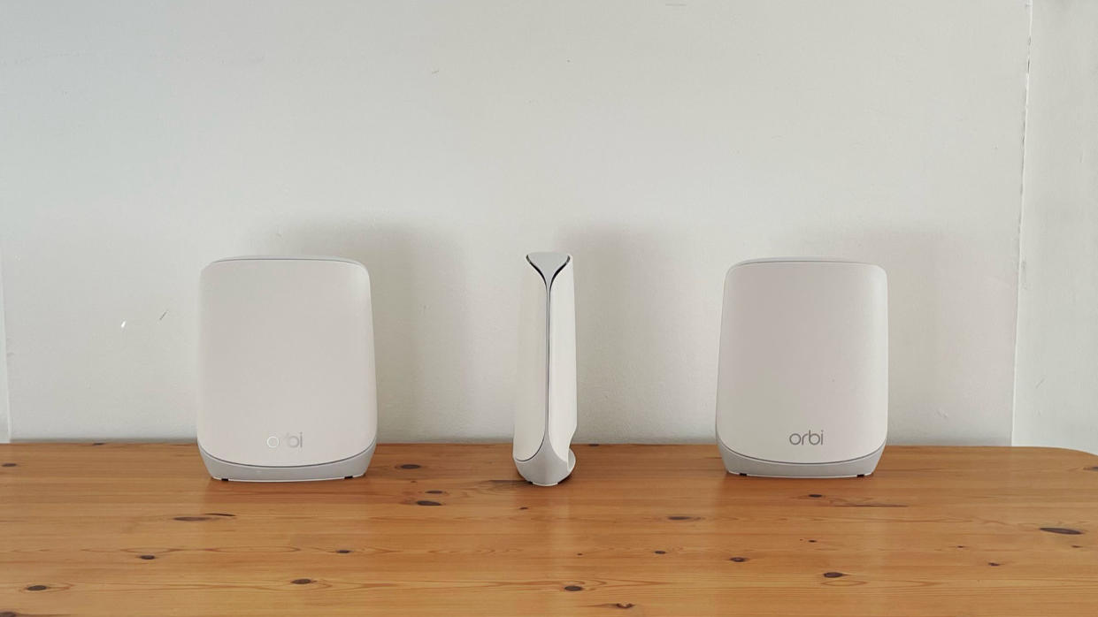  Netgear Orbi RBK763 on a wooden table 