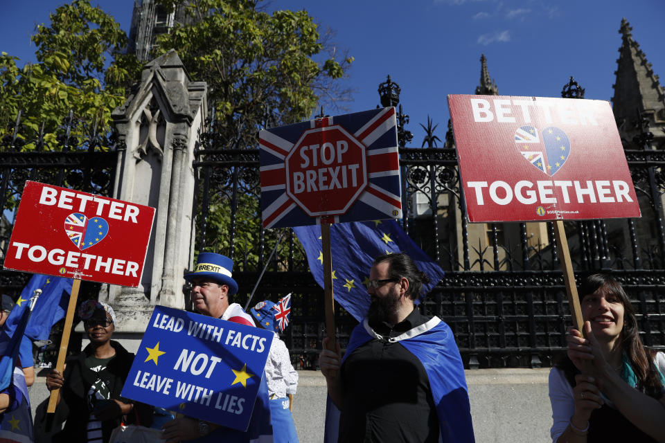 Ani-Brexit protesters demonstrate outside the Houses of Parliament in London, Thursday, Sept. 12, 2019.European Parliament President David Sassoli says British Prime Minister Boris Johnson's government has made no new proposals that would unblock Brexit talks and that talking about removing the so-called backstop from the divorce agreement is a waste of time. (AP Photo/Alastair Grant)