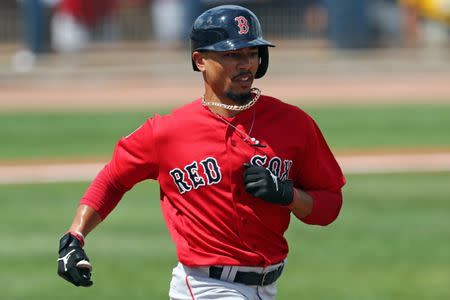 FILE PHOTO: Mar 10, 2019; Port Charlotte, FL, USA; Boston Red Sox right fielder Mookie Betts (50) grounds out against the Tampa Bay Rays in the fourth inning at Charlotte Sports Park. Mandatory Credit: Aaron Doster-USA TODAY Sports